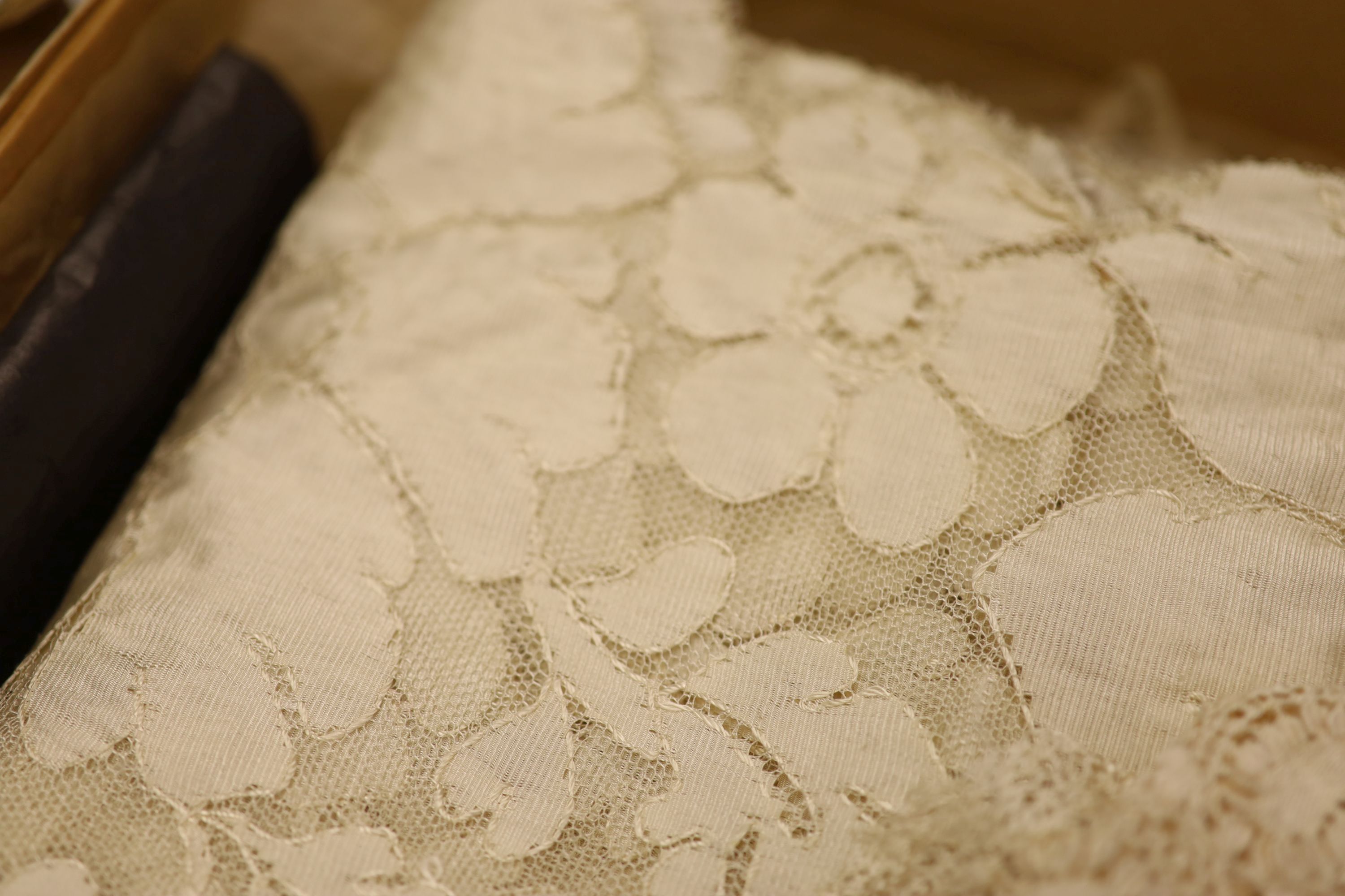 A silk lace stole, collar and Maltese collar, christening shawl, tape lace collar, a metallic gold and silver machine lace panel etc